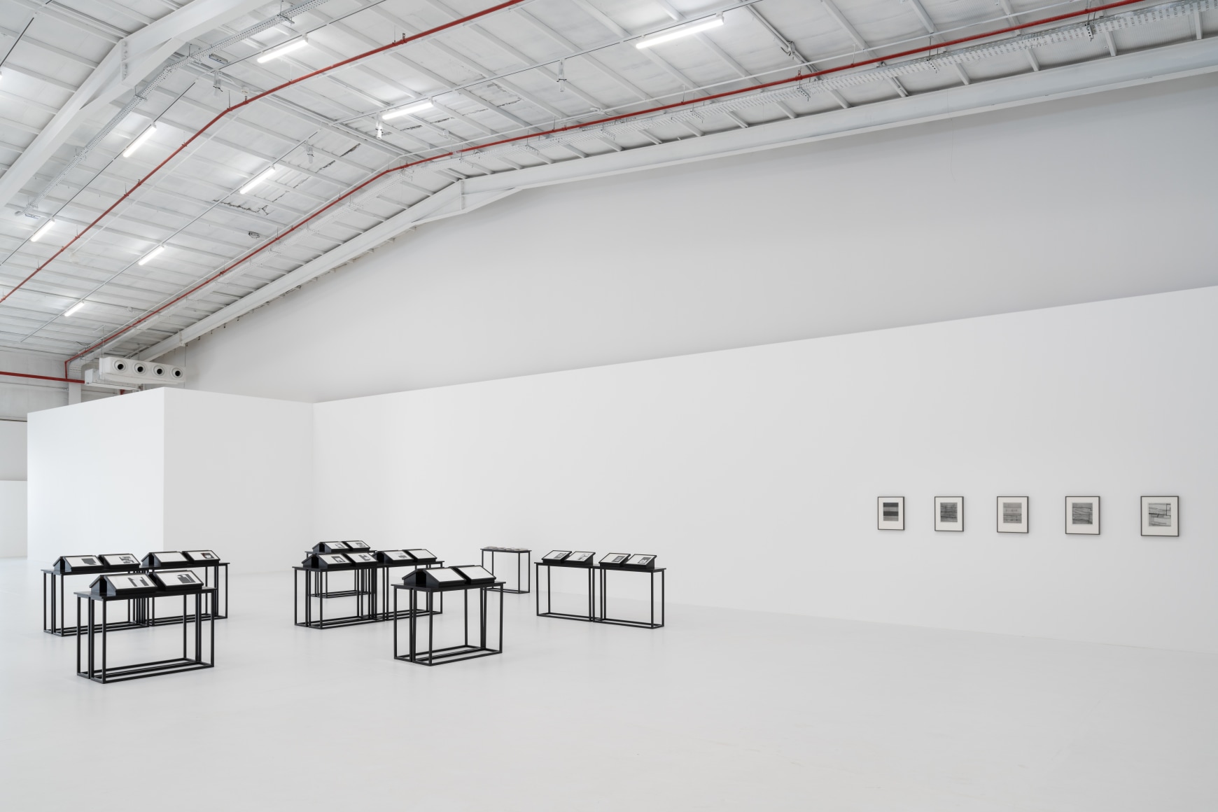 After Rain, Diriyah Contemporary Art Biennale 2024, Seher Shah, Notes from a City Unknown (2021), Portfolio of 32 screen prints on paper, Translation and production of Arabic booklet, Of Dust and Measure (5&ndash;9) (2019&ndash;21), Graphite, ink, and graphite dust on cotton paper, Courtesy of the Diriyah Biennale Foundation, photo by Marco Cappelletti