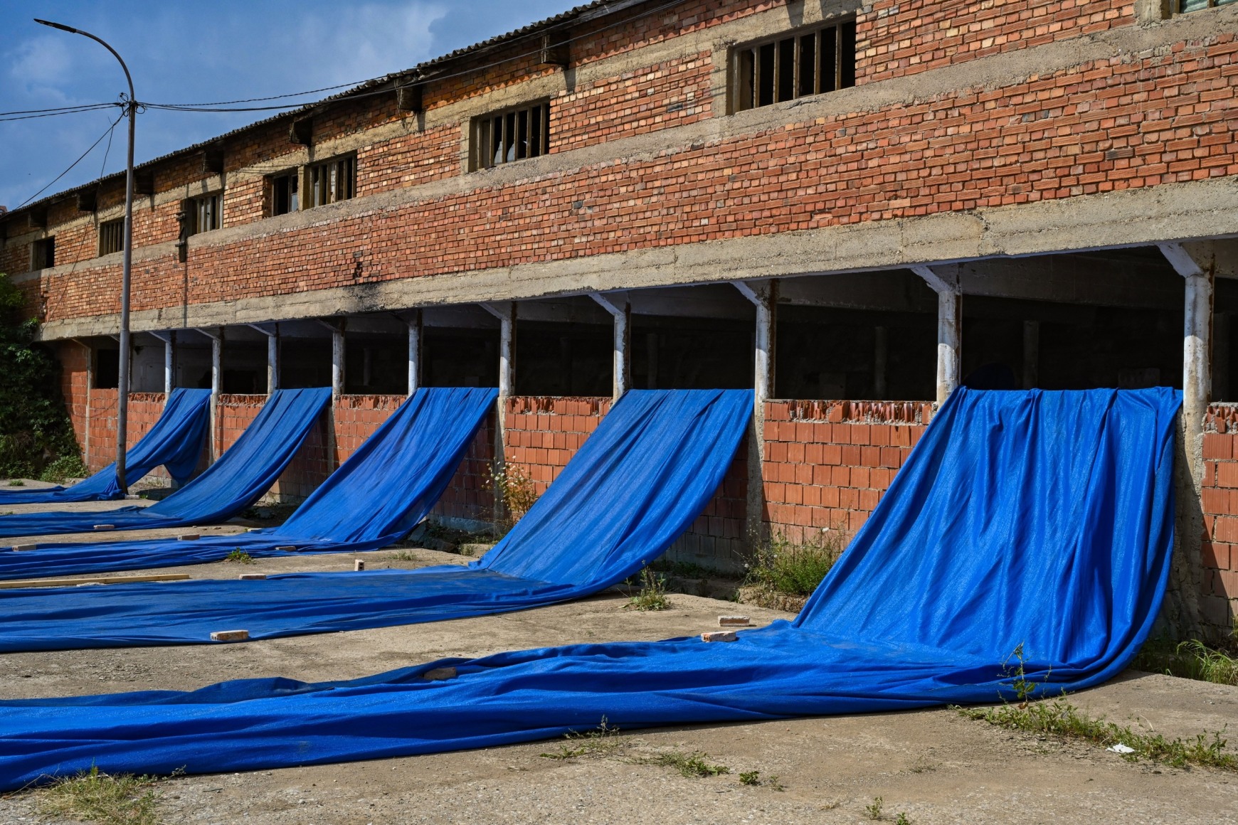 Hera Büyüktasçiyan, Who Speaks From The Dust, Who Looks From The Clay, 2023, Installation view at Brick Factory, Autostrada Biennale, Kosovo, 2023