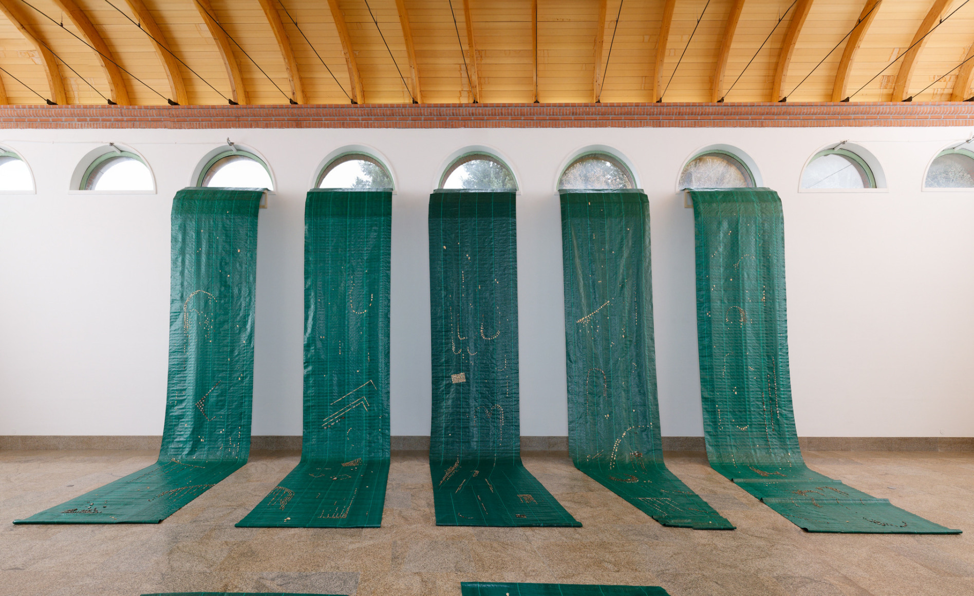 Hera&nbsp;B&uuml;y&uuml;ktaşcıyan, Defending Ancient Waters, 2023, Installation, Geotextile, tree barks, 150 x 800 cm per each piece