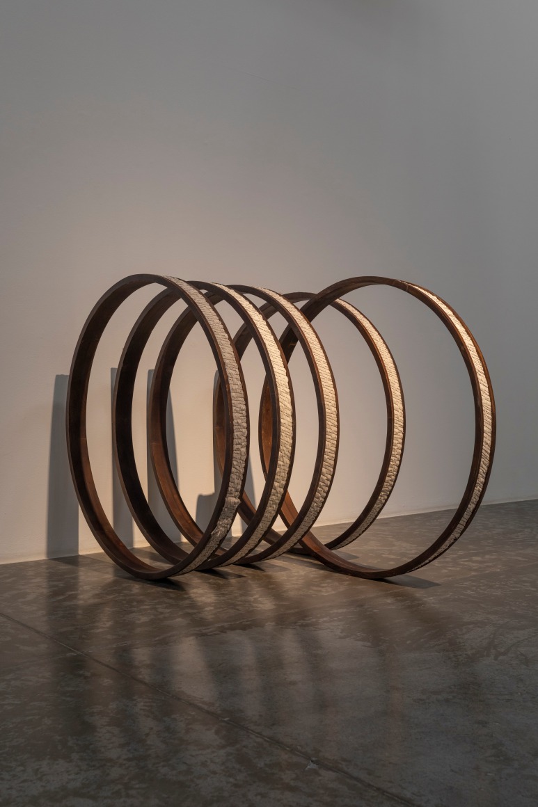 Afra Al Dhaheri, Round and round we go, 2023, Bobby pins and cotton rope on stained wood