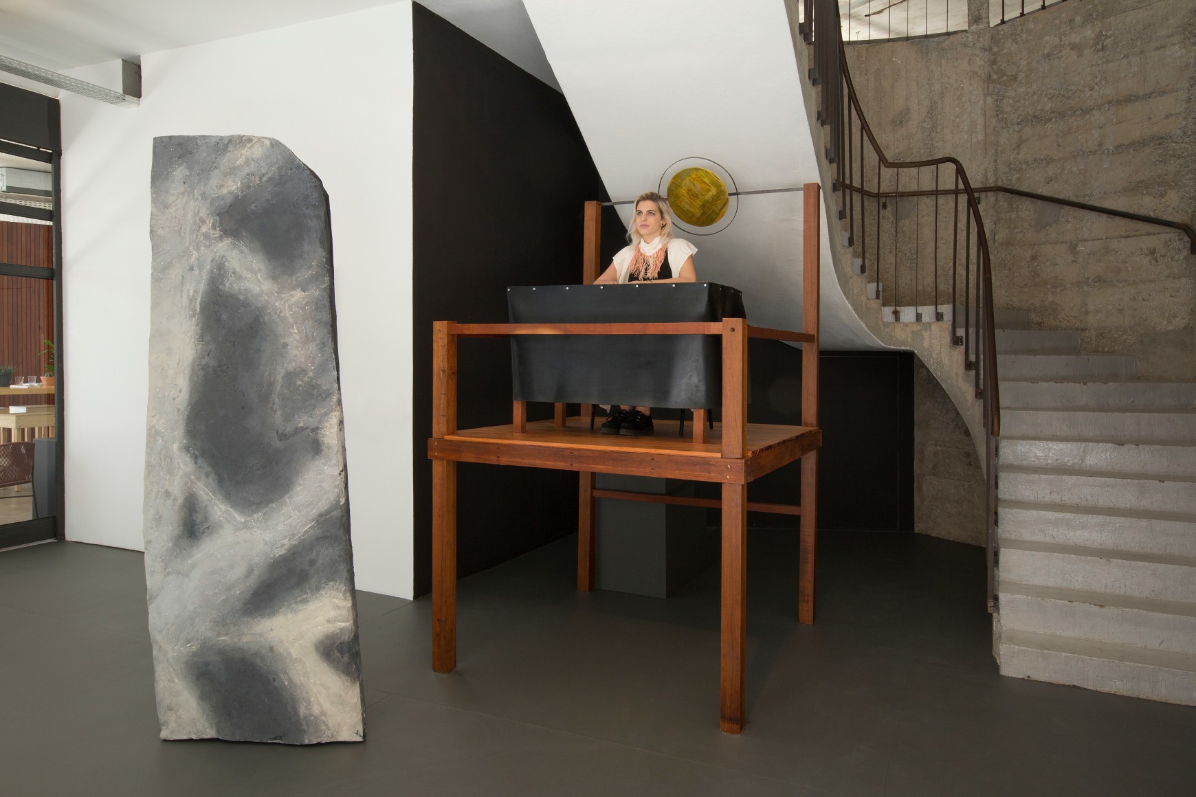 Ana Mazzei, Monolith and the Sentinel, 2015, Performer, styrofoam, iron, rubber and wood,