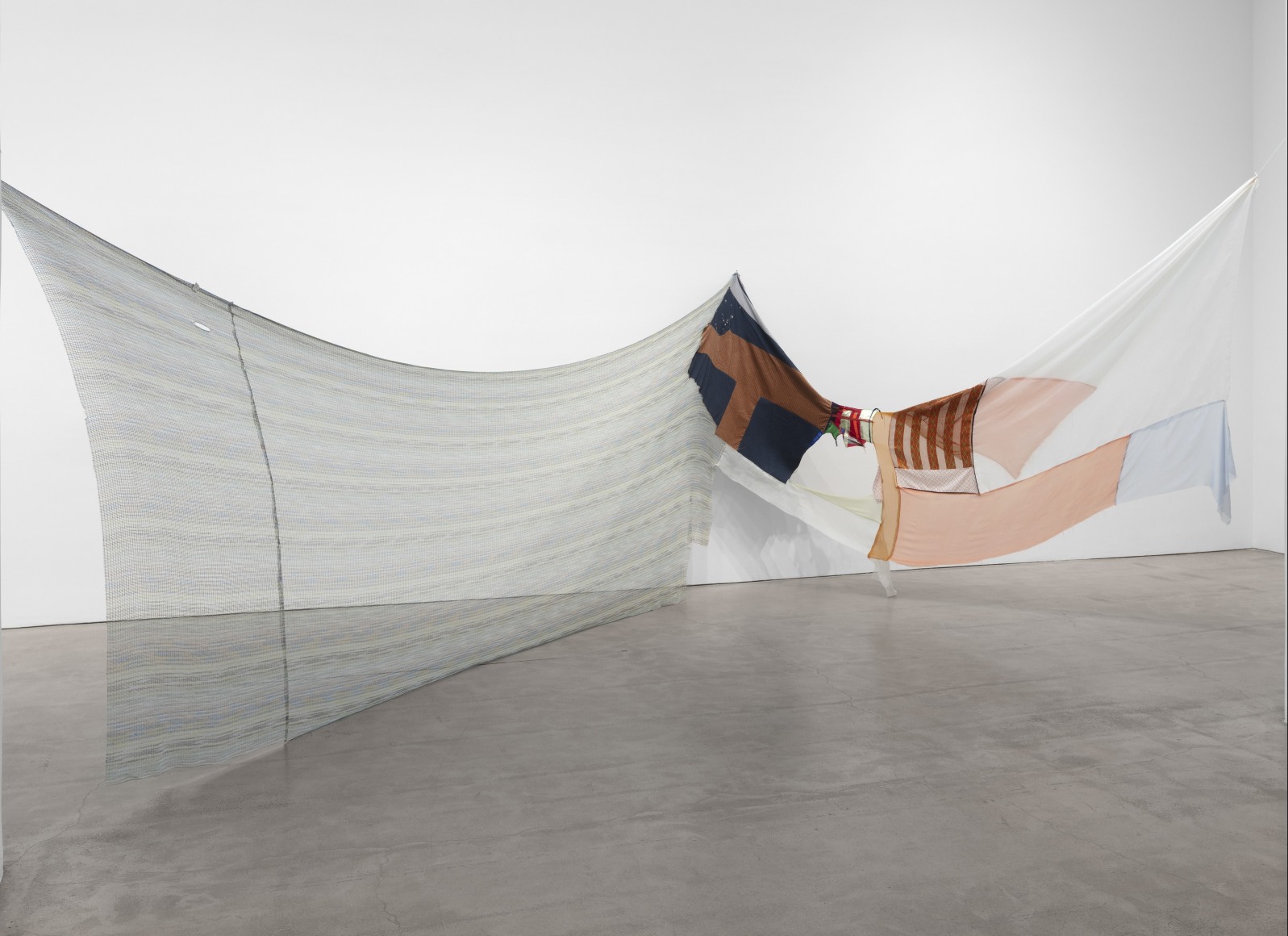 Installation view of Eric N. Mack 'Chloe&rsquo; is just the name of the girl in the photograph, 2019 assorted fabric, t-shirt, corduroy, oil cloth, Missoni knit, and thread  72 x 284 x 192 in. (182.9 x 721.4 x 487.7 cm)