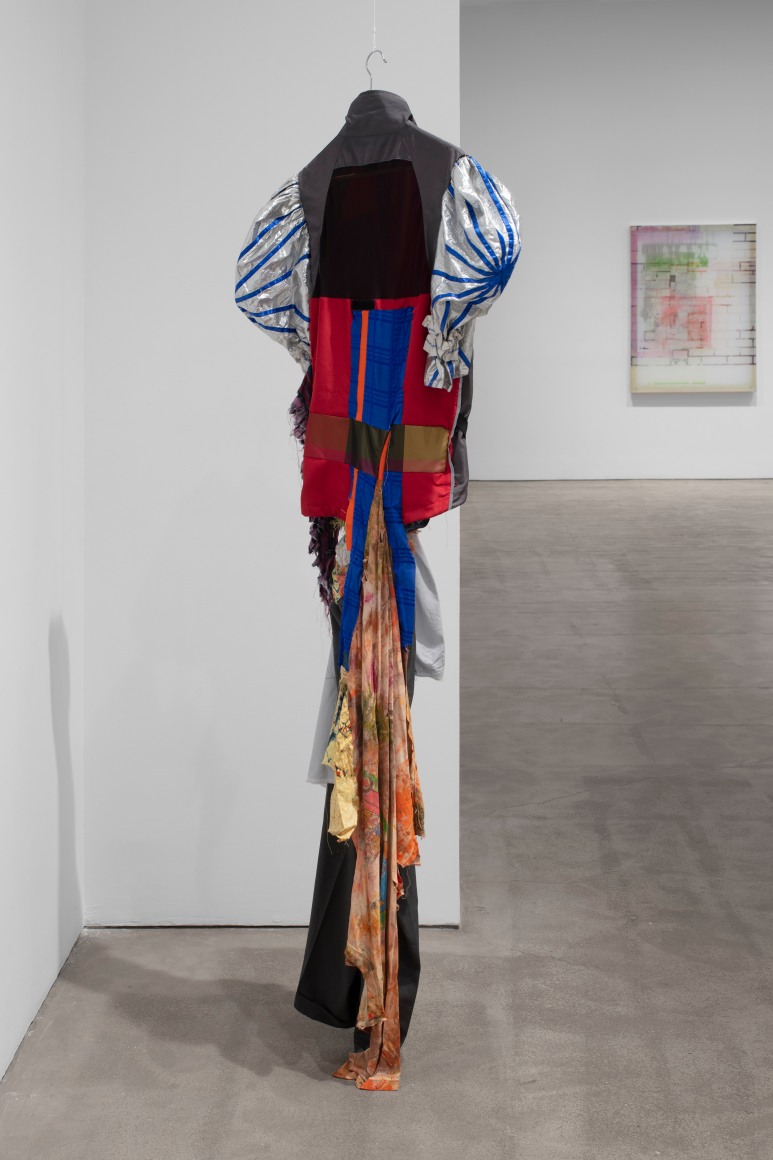View of back of Eric N. Mack's piece Performance (suit), 2019  assorted garments, thread, pins  80 x 25 x 12 in. (203.2 x 63.5 x 30.5 cm)