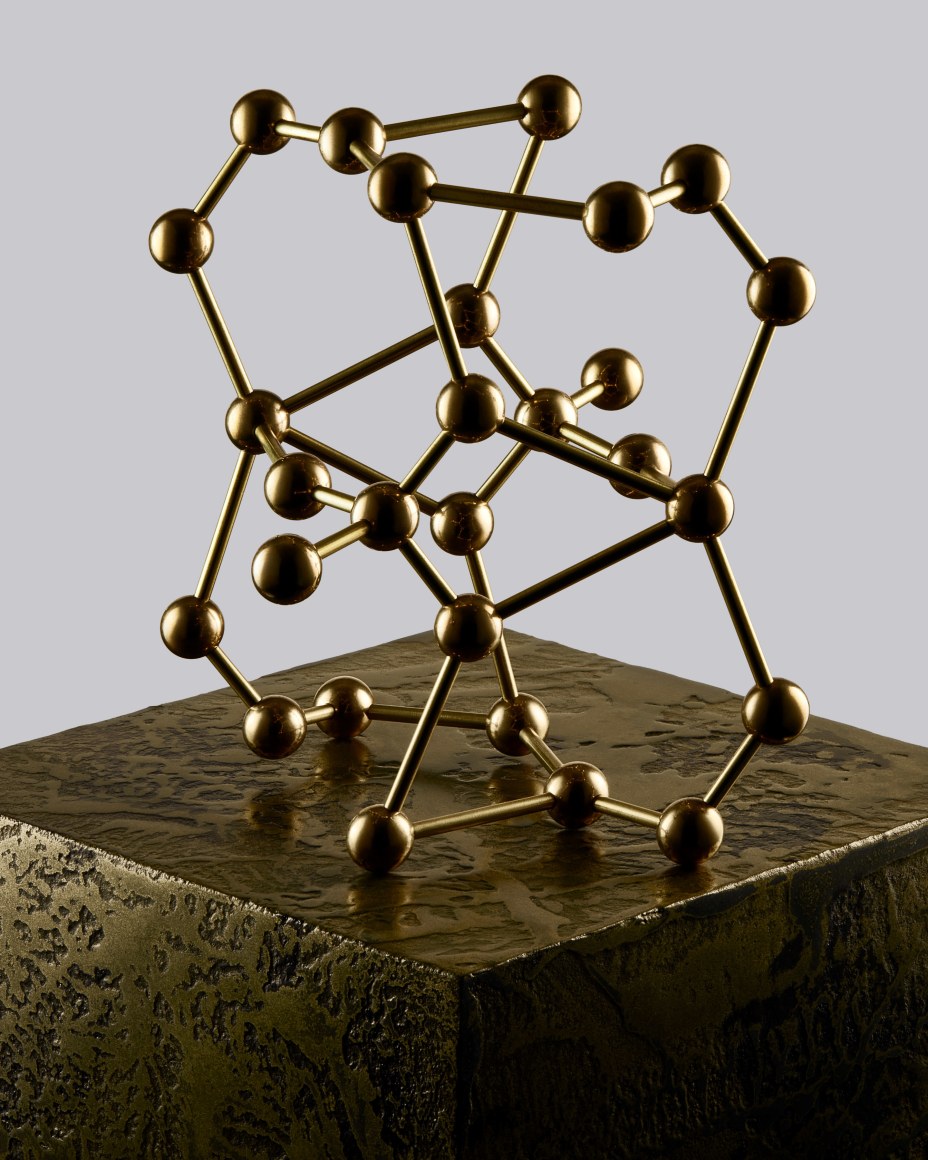 Fine mineral photograph of a brass anhydrite molecular model for wilensky exquisite minerals habits exhibition.