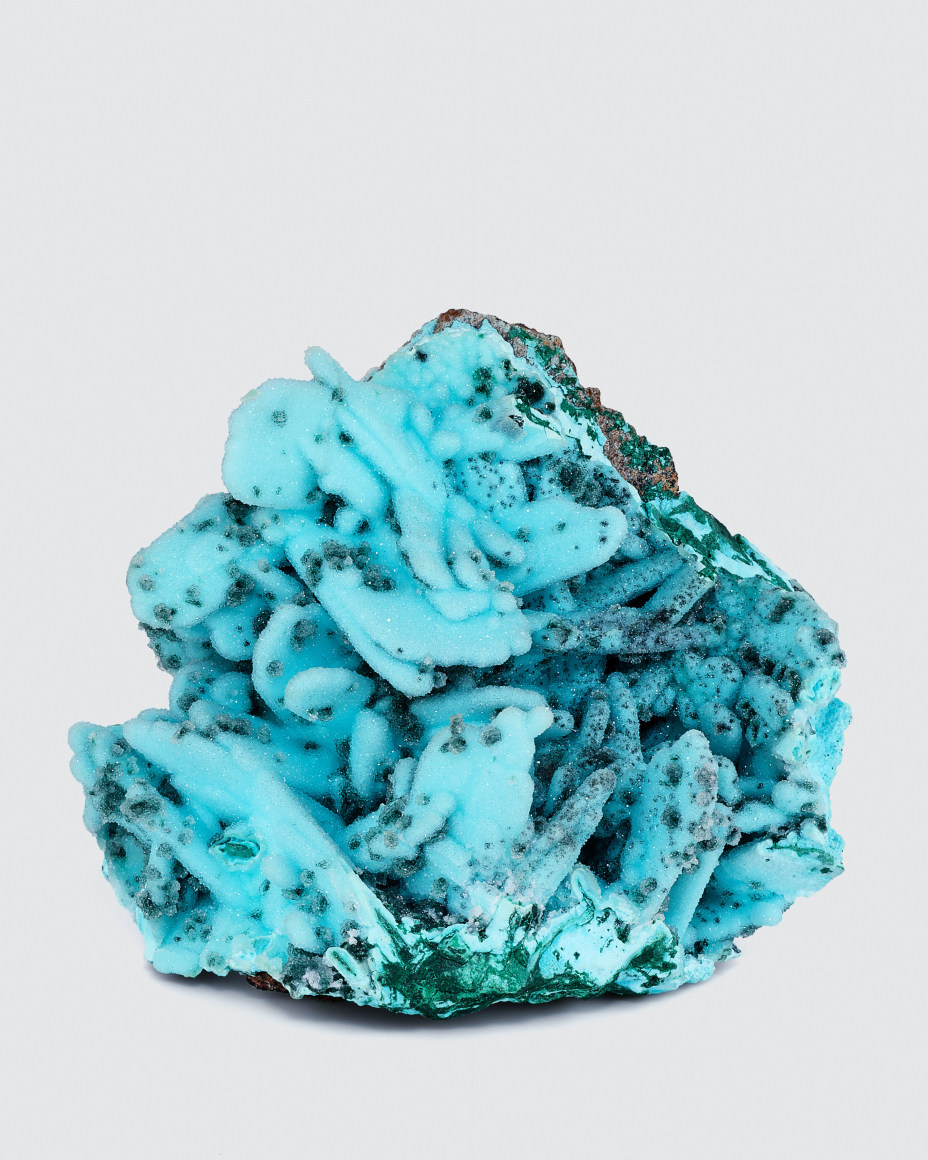 Chrysocolla after Azurite possibly Barite) with Malachite coated with druzy Quartz photo on white