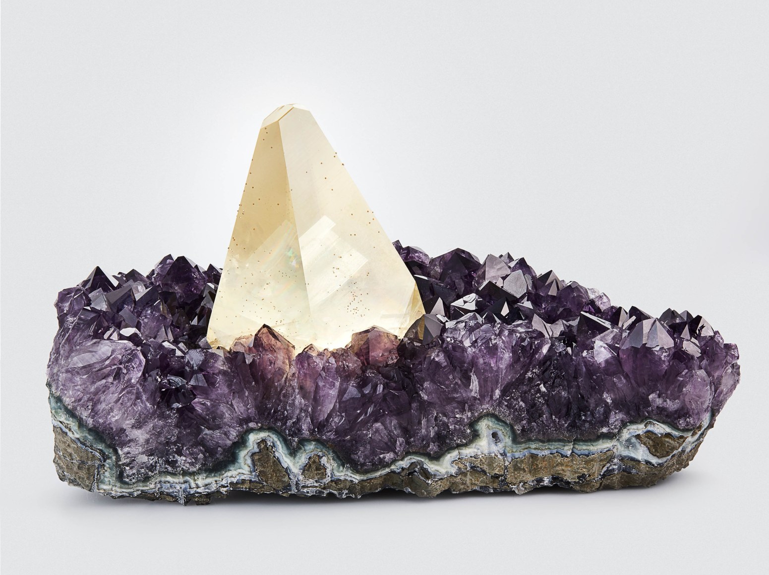 Illumination, Calcite on Amethyst with Chalcopyrite on white, Artigas, Artigas Department, Uruguay 16 cm tall x 26.8 cm wide