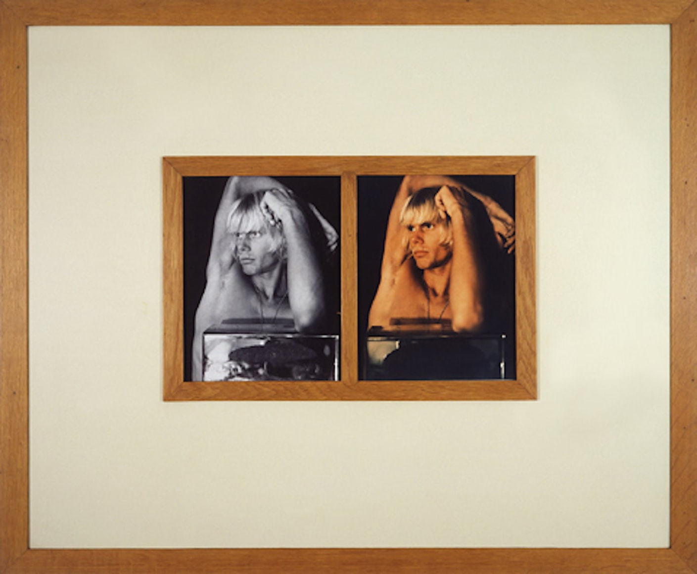 Two portraits of white male, one in black and white and one in color, framed.