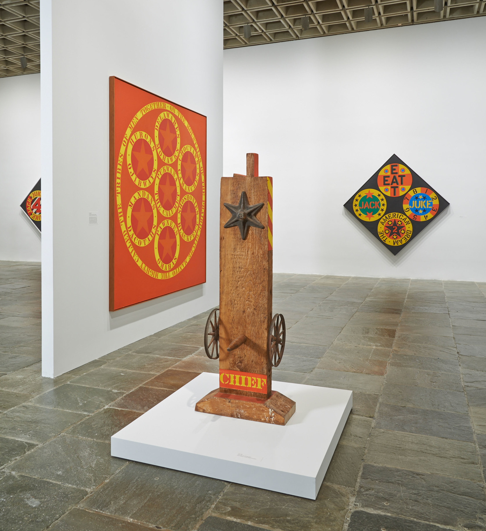 Installation view of&nbsp;Robert Indiana: Beyond LOVE, Whitney Museum of American Art, New York, September 26, 2013&ndash;January 5, 2014. Left to right, The Calumet (1961), Chief (1962), and The Black Diamond American Dream #2 (1962), &nbsp;