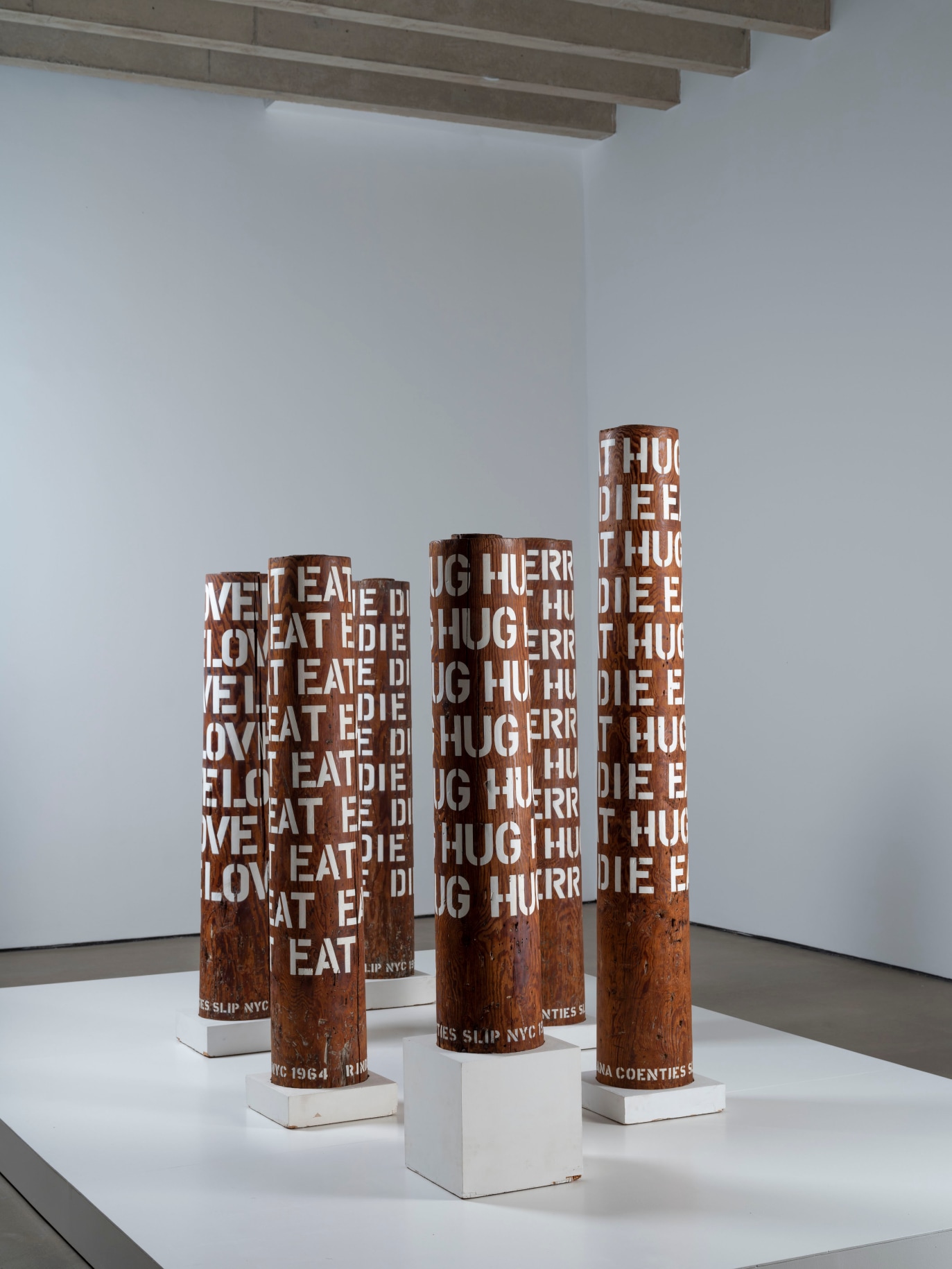 Installation view of six of Indiana's wooden columns as the Yorkshire Sculpture Park.