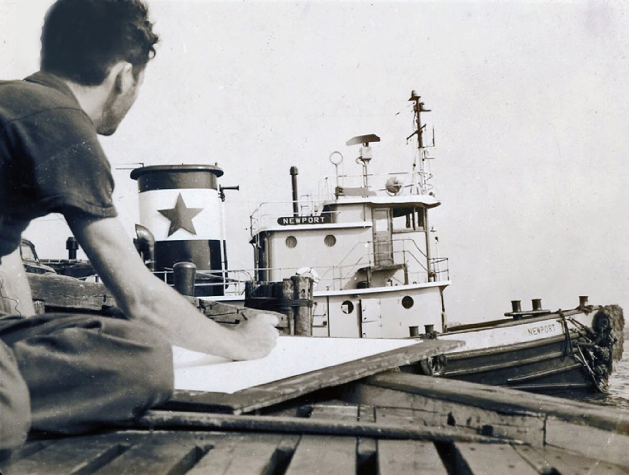 Robert Indiana drawing the tugboat Newport, 1956. Photo: Jack Youngerman