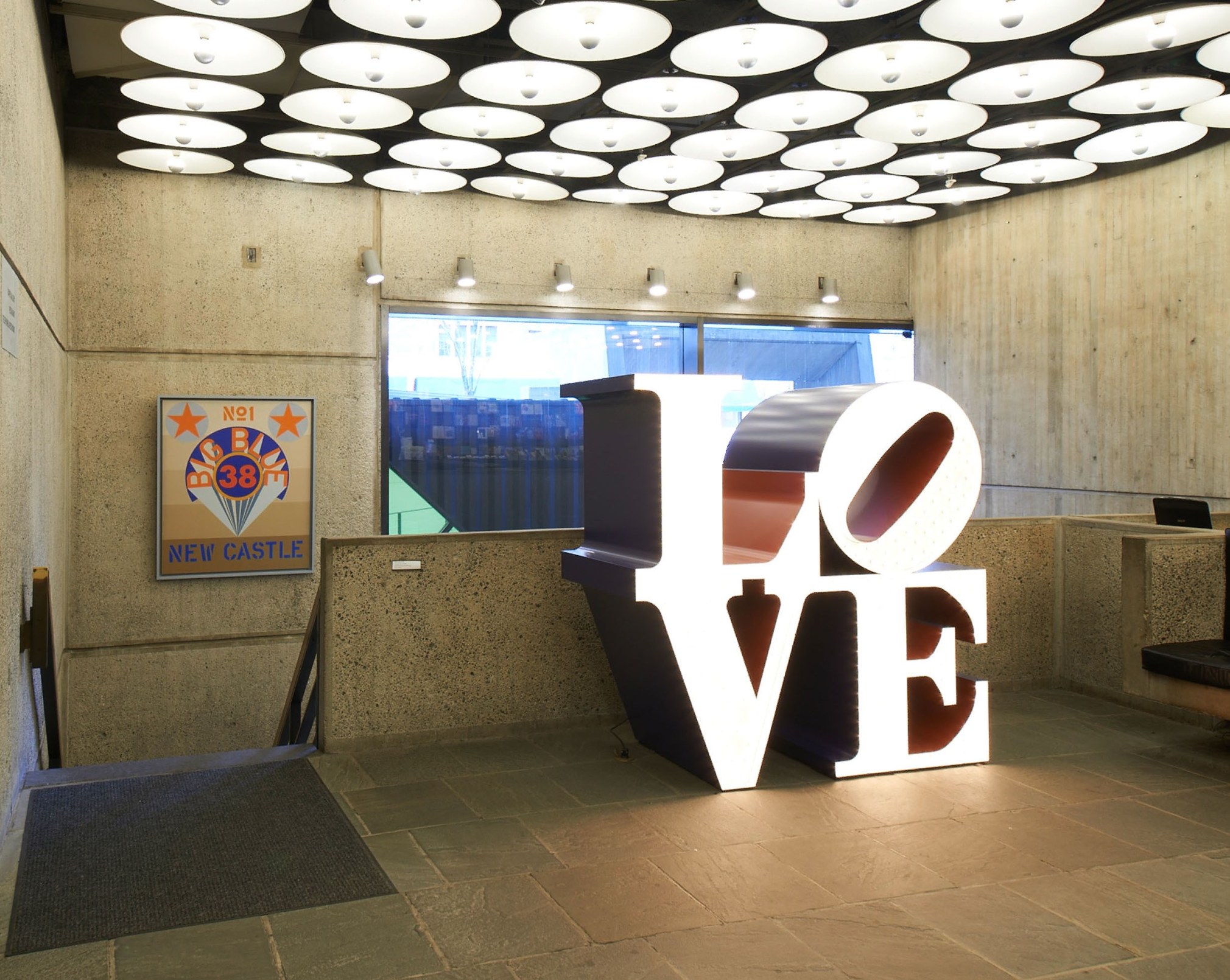 Installation view of Robert Indiana: Beyond LOVE,&nbsp;Whitney Museum of American Art, New York, September 26, 2013&ndash;January 5, 2014. Left to right,&nbsp;New Castle (1969) and&nbsp;The Electric LOVE (1966&ndash;2000), &nbsp;