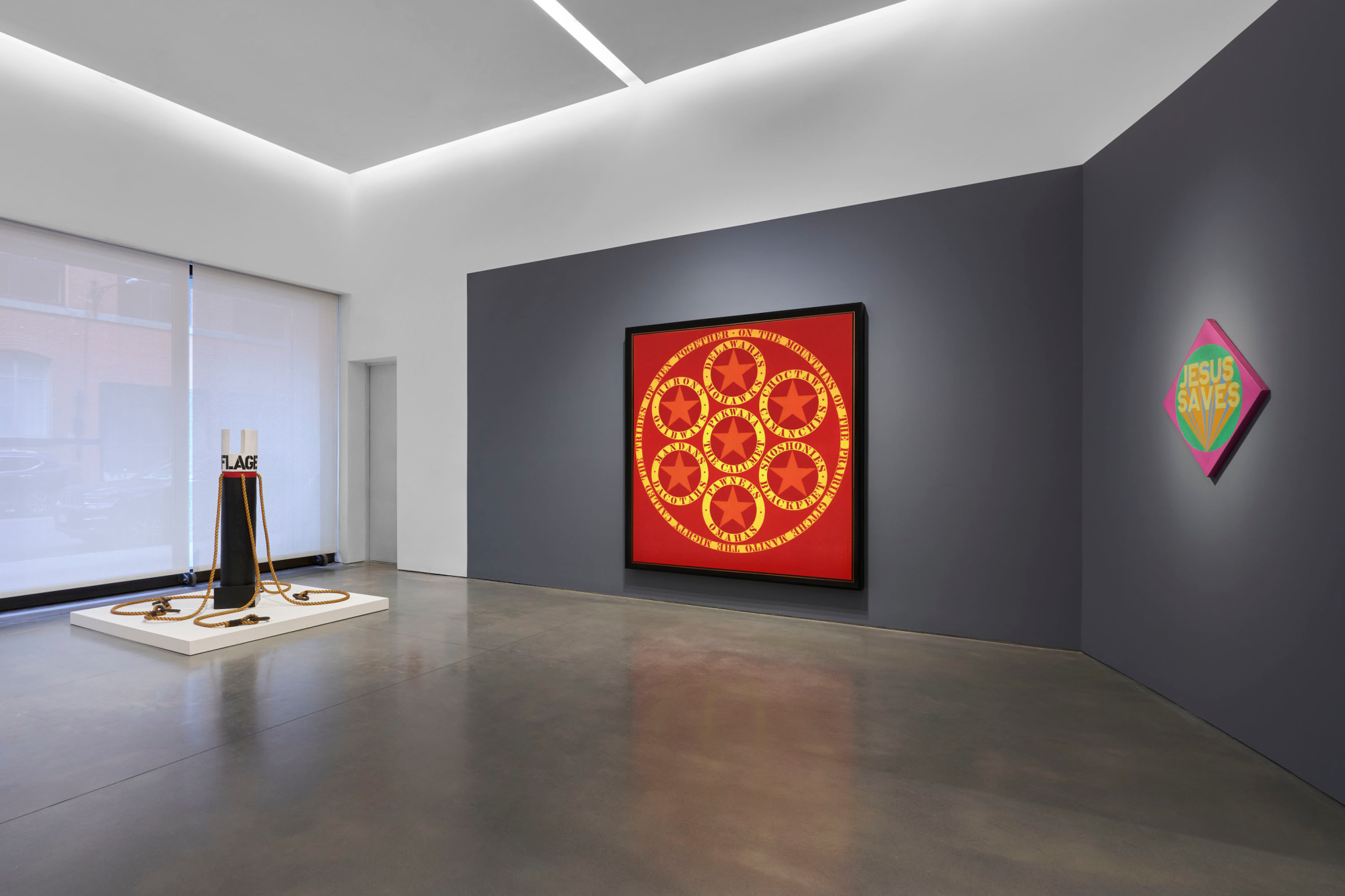 Installation view, Robert Indiana: The American Dream, Pace Gallery, New York, May 9&ndash;August 15, 2025. Left to right, Red Sails (1963), Flagellant (1963/1969), and Jesus Saves (1969)