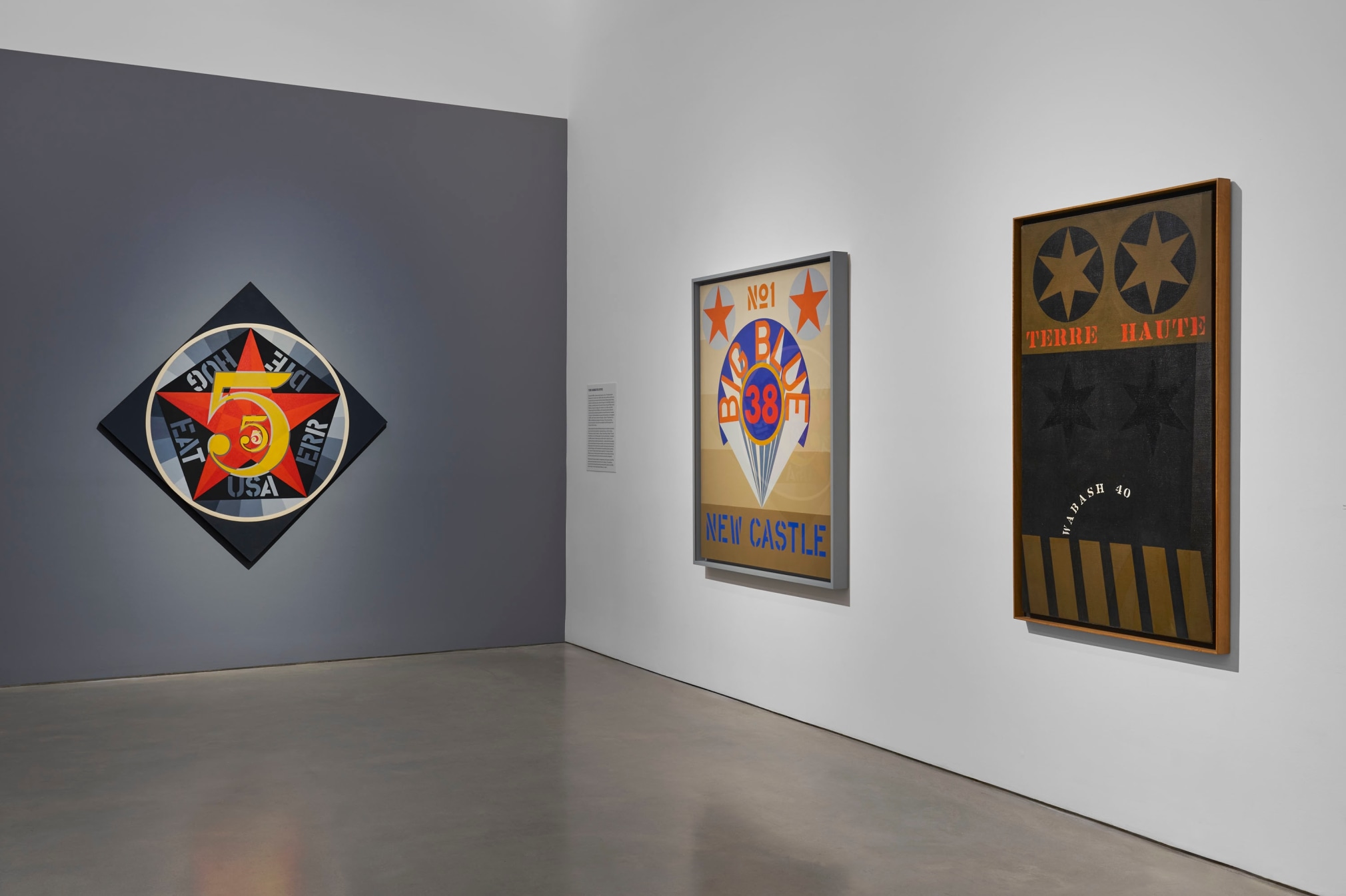 Installation view, Robert Indiana: The American Dream, Pace Gallery, New York, May 9&ndash;August 15, 2025. Left to right, The Demuth Five (1963), New Castle (1969), and Terre Haute (1960)
