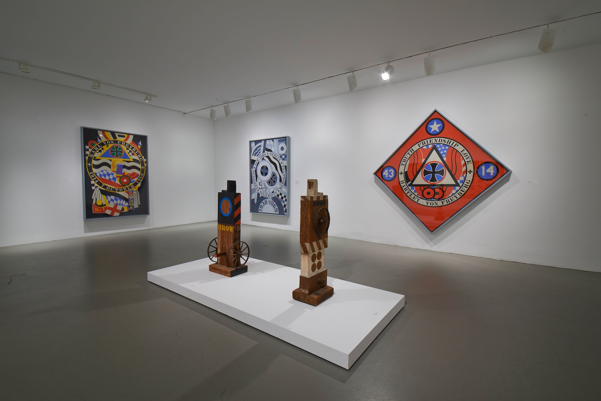 Installation view of Robert Indiana: Beyond LOVE, Whitney Museum of American Art, New York, September 26, 2013&ndash;January 5, 2014. Left to right, KvF I (Hartley Elegy) (1989&ndash;94), Brow (1960&ndash;62), Kvf IV (Hartley Elegy) (1989&ndash;94), M (1960), and KvF X (Hartley Elegy) (1989&ndash;94), &nbsp;