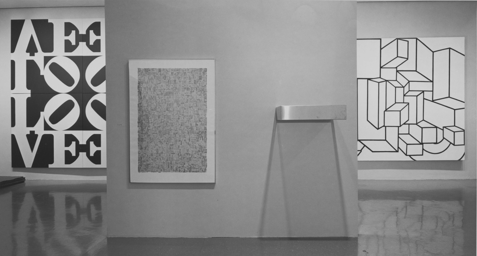 Installation view of the exhibition&nbsp;In Honor of Dr. Martin Luther King, Jr.&nbsp;at the Museum of Modern Art, New York, 1968; left to right, Indiana&rsquo;s Love Rising (The Black and White Love), and works by Jasper Johns, Donald Judd, and Al Held. Image courtesy of the Museum of Modern Art, New York