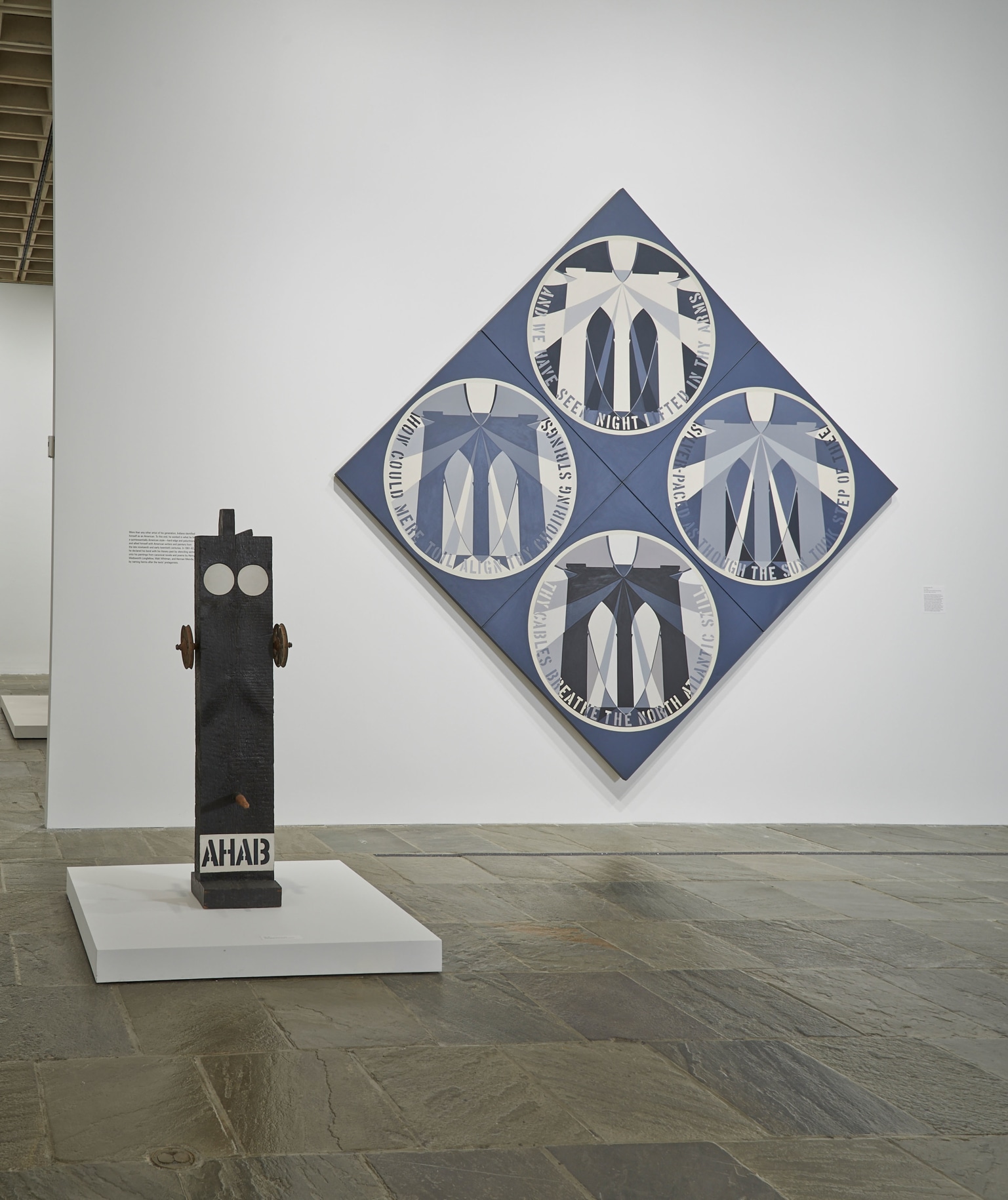 Installation view of Robert Indiana: Beyond LOVE, Whitney Museum of American Art, New York, September 26, 2013&ndash;January 5, 2014. Left to right, Ahab (1960&ndash;62) and The Brooklyn Bridge (1964), &nbsp;