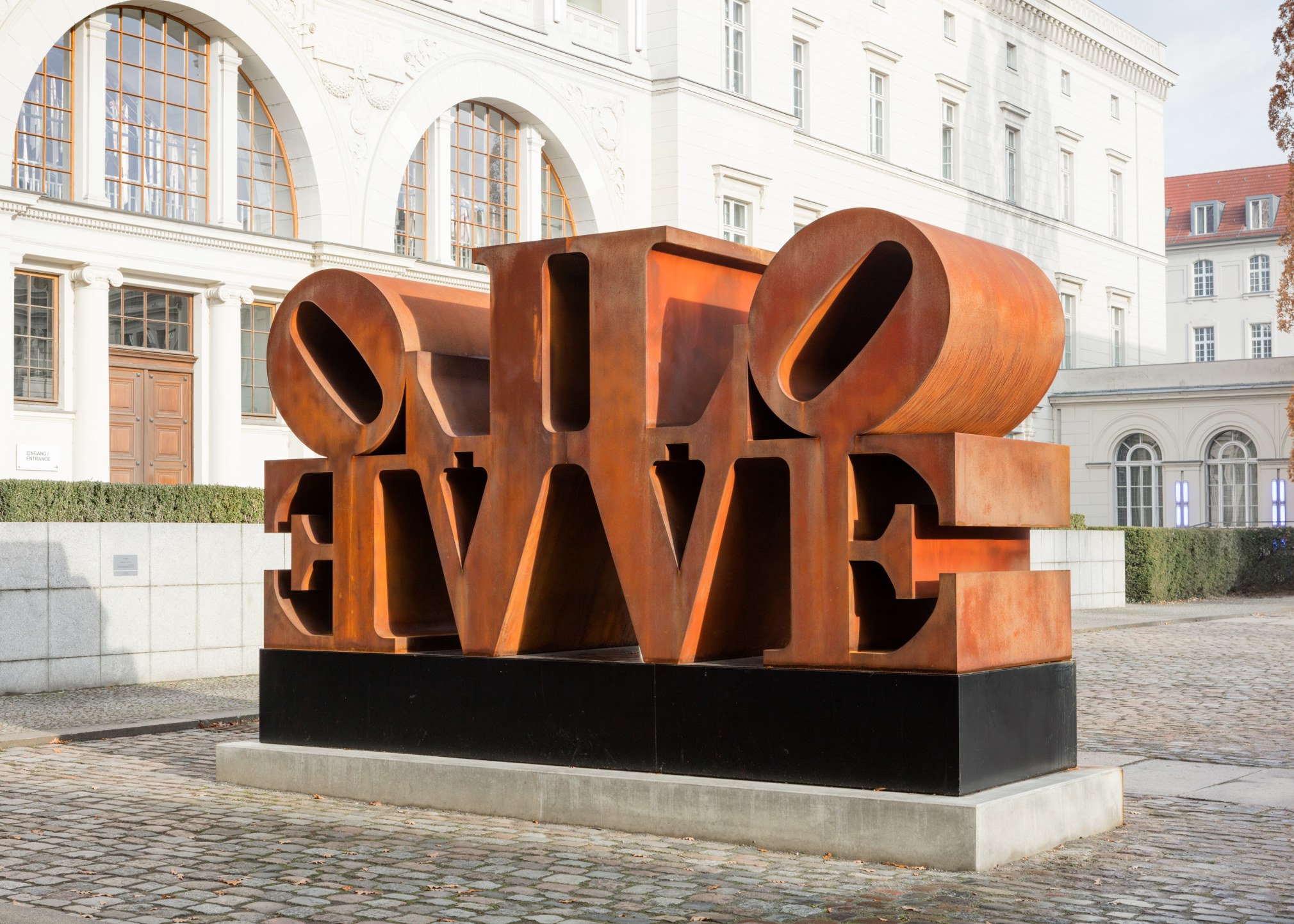 Imperial LOVE, a 96 by 192 by 60 inch Cor-Ten steel sculpture consisting of two quadripartite LOVE sculptures side by side, with the L and V of each sculpture back to back and the O and E facing outwards.