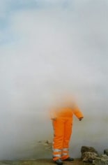 Photo of construction worker obscured by fog