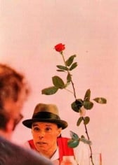 Photo of man talking with red rose