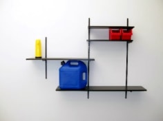 artist made shelving with gasoline can