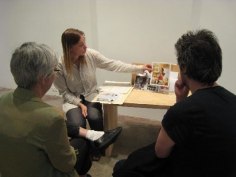 Installation view with people talking
