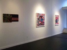 Installation view of photo collages and rainbow abstract
