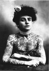 Black and white postcard of tattooed woman