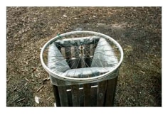 Photo of metal bike spokes placed over trashcan