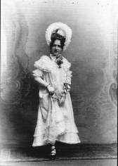 Black and white postcard of woman in antiquated clothing