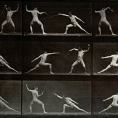 Black and white photographs of two nearly nude men fencing. 