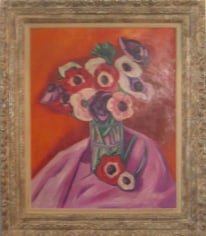 Framed painting of a bouquet of flowers in a glass vase sitting on magenta fabric. The background is a warm orange, and the flowers are in shades of red, white, purple, and light pink with black centers and green stems.