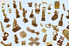 Video still from &quot;Life in Miniature: Asante goldweights&quot; February 9&ndash;July 27, 2012 showing. Multiple gold Asante figurines, specifically Asante gold weights.