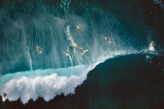 Alex MacLean, Surfers Behind Breaking Waves at Sunset Beach, Oahu, Hawaii, 1998. Chromogenic print, 30 x 40 inches.
