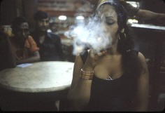 Transvestite smoking in the Olympia Cafe, Bombay, 1978, 12-1/4 x 18-3/4 Dye Transfer Photograph, Ed. 15