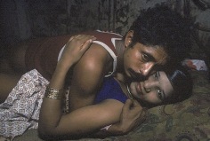 A young prostitute with sad eyes, with a customer, Bombay, 1978, 12-1/4 x 18-3/4 Dye Transfer Photograph