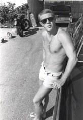 Steve McQueen (leaning against car in garage), Palm Springs, CA, 1962 (Plate 93), 20 x 16 Silver Gelatin Photograph, Ed. 15