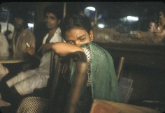 Young street prostitute crying in the Olympia Cafe, Falkland Road, Bombay, 1978, 12-1/4 x 18-3/4 Dye Transfer Photograph