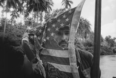 Dennis Hopper plays with an American Flag, Apocalypse Now, Pagsanjan, Philippines, 1976, 16 x 20 Silver Gelatin Photograph, Ed. 25