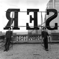 Collin and David Leaning on Rooftop Letters, Alberta, Canada, 2004, Archive Number: HSI-0804-044-02, 16 x 20 Silver Gelatin Photograph