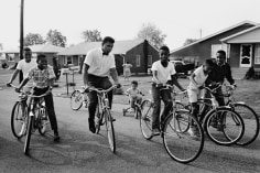 Muhammad Ali (Cassius Clay) Biking with Neighborhood Kids, Louisville, Kentucky, 1963, Silver Gelatin Photograph