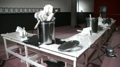 , POPE.L Performance Table (with Corbu Popsicle/ Hatchets dipped in black liquid and vaseline)