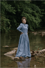 Stacy Kranitz  Stacy as Christy, 2012   Archival pigment print 16 x 24 inches, Edition of 7  27 x 40 inches, Edition of 3, Woman posing in period dress on a rock in a river.