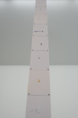 Marco Maggi, Fanfold Fall, 2013. Wide hanging from ceiling to floor with cuts in both faces, 7 in. wide.