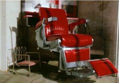 William Eggleston. UNTITLED (RED BARBER CHAIR). 1974.
