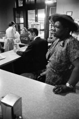 Alfred Wertheimer, Segregated Lunch Counter: Elvis Presley waits for his bacon and eggs at the railroad station lunch counter while a black woman waits for her sandwich, Chattanooga, Tennessee, 1956