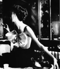 Lillian Bassman, Across the Restaurant: Barbara Mullen in a dress by Jacques Fath at Le Grand Vefour, Paris. Harper&#039;s Bazaar, 1949