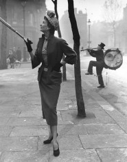 Norman Parkinson, Model on Sidewalk with Striped Hat, circa 1950