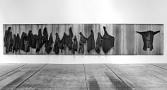Untitled 2012 iron panel, iron hooks and overcoats