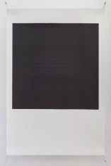 A photograph of a silkscreen on paper. The shape resembles a polaroid (white space on the bottom and a white frame around a central black space). The black space in the middle of the work has text in faint blue letters, illegible from a distance.