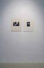 Two Herv&eacute; Guibert black and white photographs in cream mattes, next to each other.